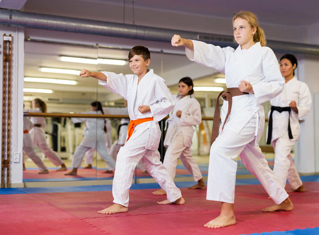 Karate kids doing kata in gym