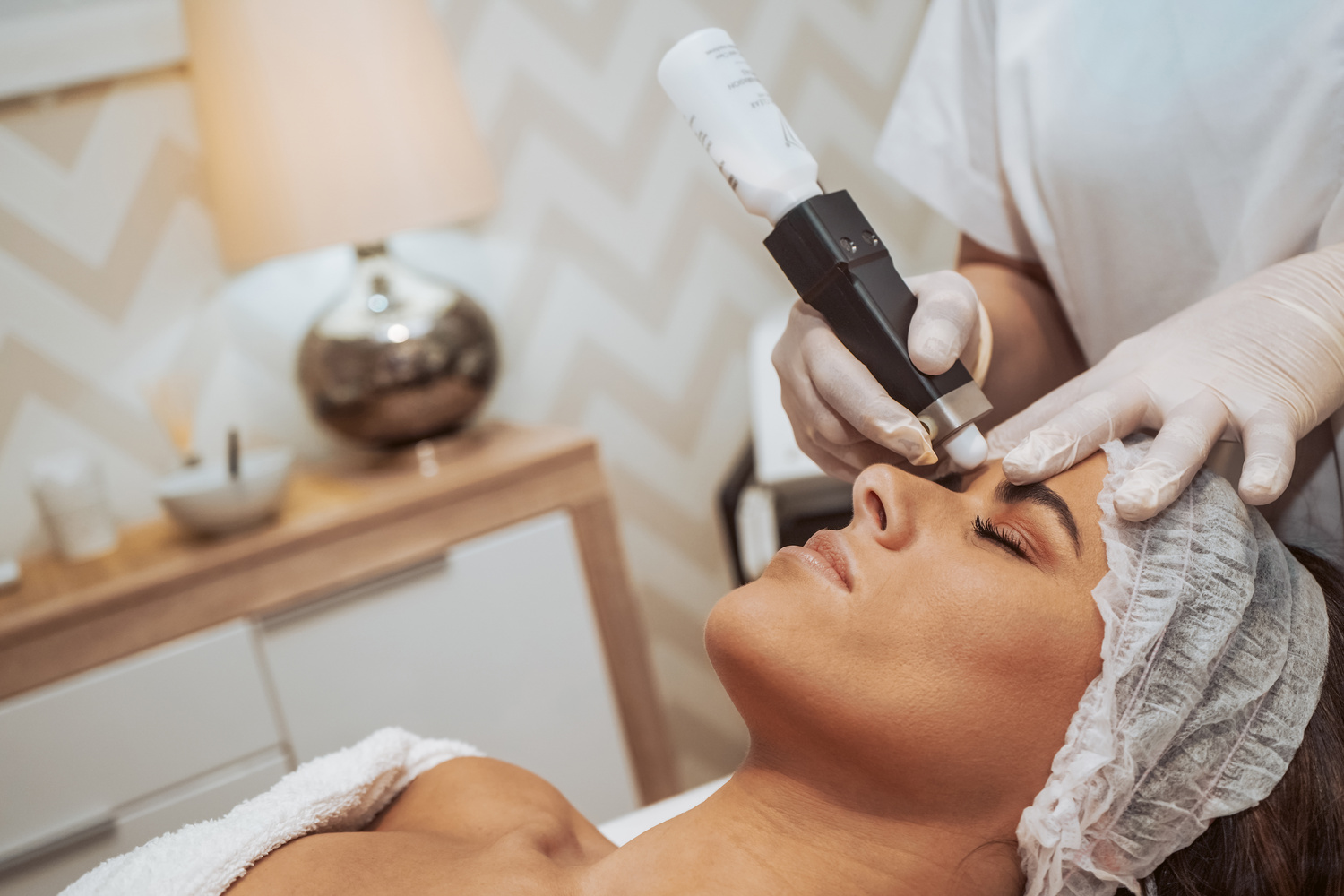 Woman Receiving Cosmetic Treatments